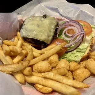 Husband&apos;s mushroom Swiss burger with 1/2 fries and 1/2 tots. He liked it a lot. They have awesome ranch dressing also!