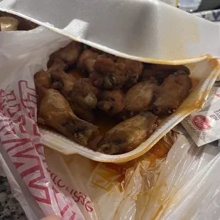 Broken box with 30 wings and juices leaking all over bag. Which btw got on my car seat