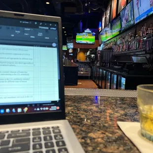 a laptop on a bar