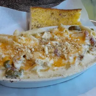 Southwest Mac &amp; Cheese with added in chicken, and a slice of garlic bread.