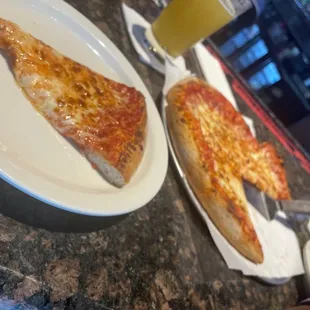 two slices of pizza on plates