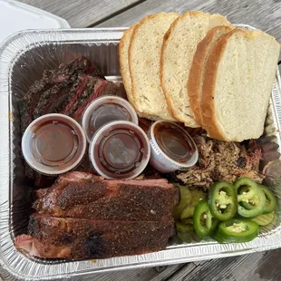 a tray of meat and sides