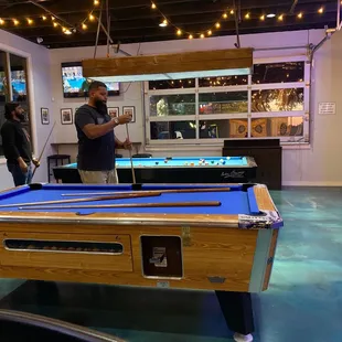 two men playing pool