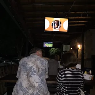 two people watching tv