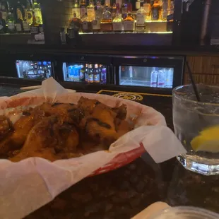 Honey hot wings, grilled and fried, with my Tito&apos;s and soda