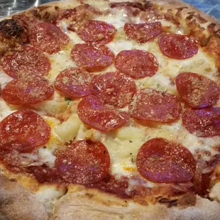 Pepperoni and pineapple pizza