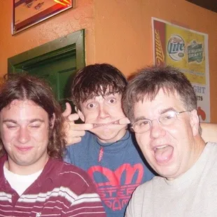 three men posing for a picture