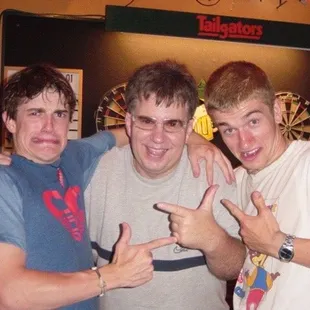 three young men posing for a picture