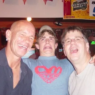 three men posing for a picture