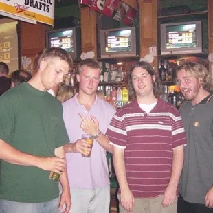 a group of men in a bar