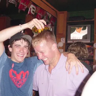 two men drinking beer