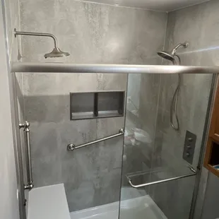 a bathroom with a shower and toilet