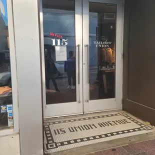 the entrance to a tailors union