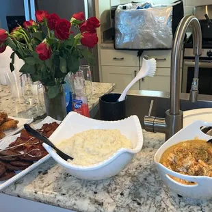 Shrimp and grits, bacon, sausage, chicken wings. Not pictured: mimosas