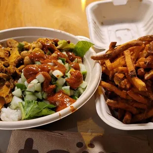 Rice, chicken shawarma bowl with cucumber and chickpeas. Fries as a side.