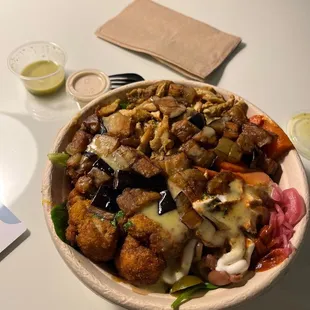 Roasted Chicken Bowl with eggplant, cauliflower shawarma, and carrots added.