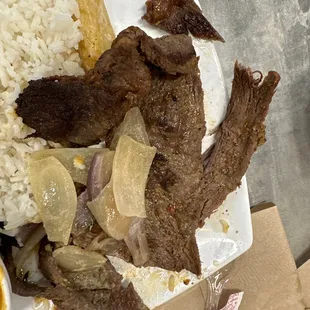 Steak with onions it's like  shoe leather I can't even can't  cut it with their plastic knife I can't even pull it apart it's disgusting.