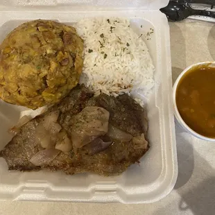 Bistec, rice, beans and mofongo.