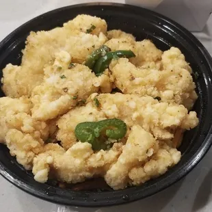 a bowl of fried tofu, a bowl of fried tofu, and a bowl of fried tofu