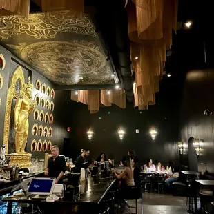people sitting at tables in a restaurant