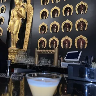 a cocktail in a glass on a bar