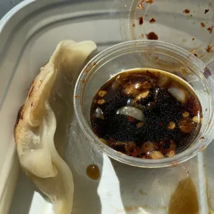 Pan fried dumpling with sauce