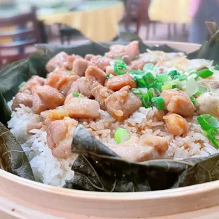 Steamed lotus leaf rice with chicken and salted fish