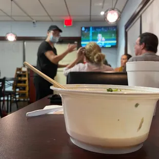 Owner greeting each table and checking how they're doing.