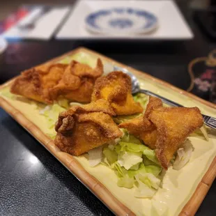 a plate of fried food on a table