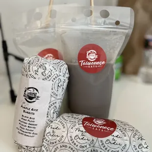 Purple rice burrito with pork floss, sticky rice roll with swordfish floss, black bean soy milk, soy milk