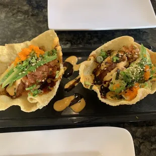 two plates of asian food