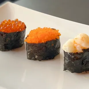 Sushi - Ikura (salmon egg), Masago (smelt egg), Hotate (scallop) 

from left to right