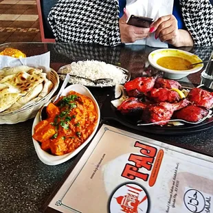 a woman taking a picture of her food
