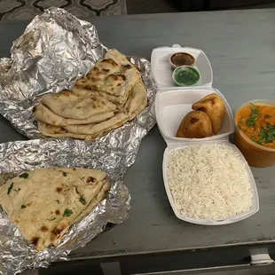 Naan, Garlic Naan, Vegetable Samosas , Basmati Rice  and Butter Chicken :)