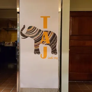 a poster of an elephant with the letter t on it