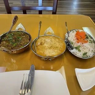 Eggplant dish on the left coconut chicken in the middle and rice on the right.