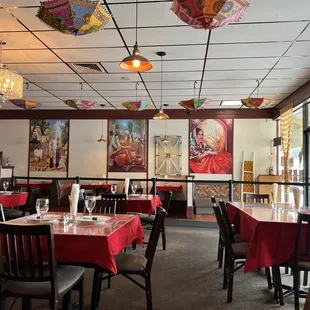 Embroidered inverted umbrellas, paintings, lighting