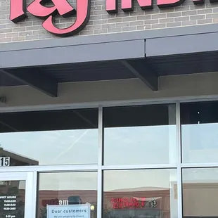 Sign on door says temporarily closed