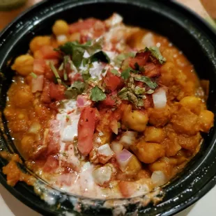 SAMOSA CHANA CHAAT  $5.95 Crispy samosa topped with chana masala gravy and yoghurt, spices, mint chutney and sweet chutney