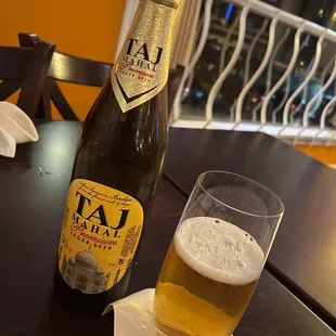 a bottle and a glass on a table