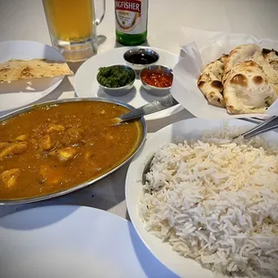 a plate of rice and a bowl of curry