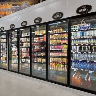 a man standing in front of a refridgerator