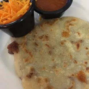 Pupusa with salad and salsa