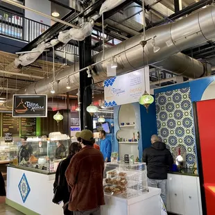 a group of people in a food court