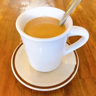 a cup of tea on a saucer