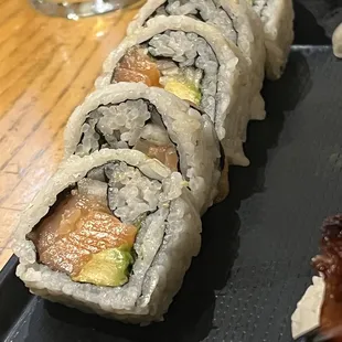 a close up of a roll of sushi