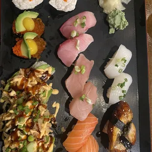 Left: Creamy scallop, snake eyes (quail egg, salmon eggs, tobiko), kari kari Middle: yellowtail, albacore, salmon Right: Squid, unagi