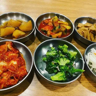 Side dishes. Potatoes, cucumbers, fish cake, kimchi, broccoli and daicon