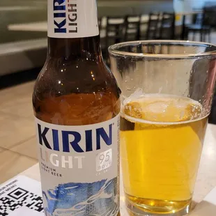 a beer and a glass on a table