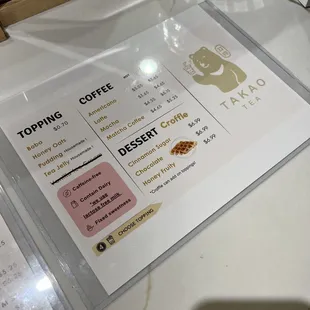 a menu and a glass of water